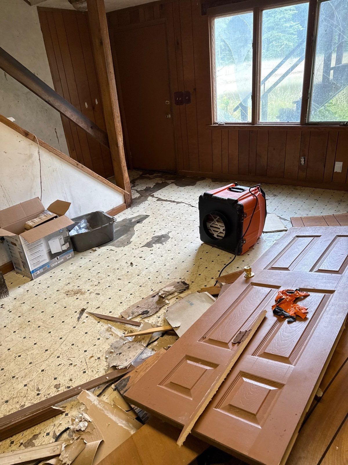 An air scrubber running in a room during cleanup