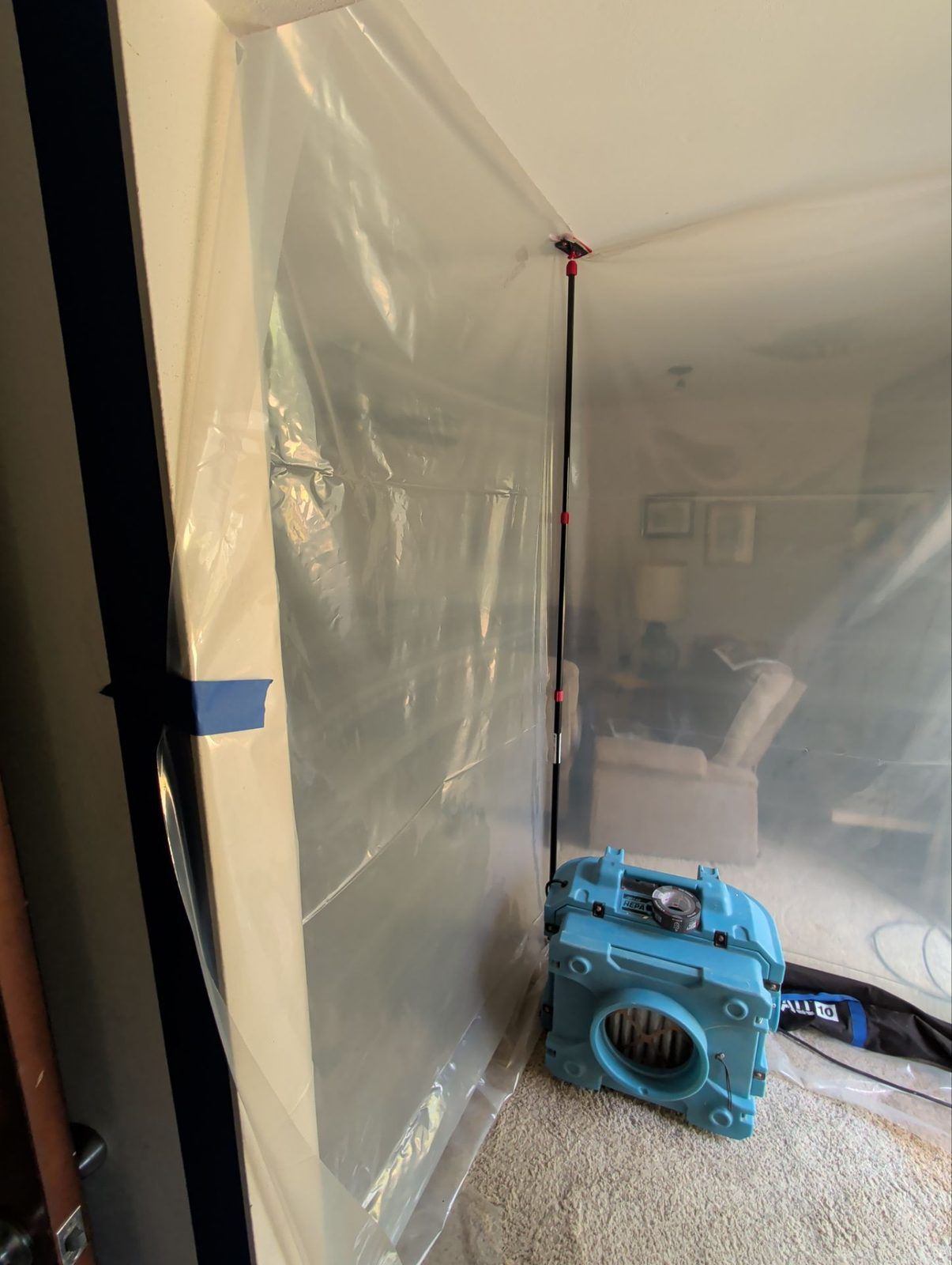 An air scrubber running at a sealed containment