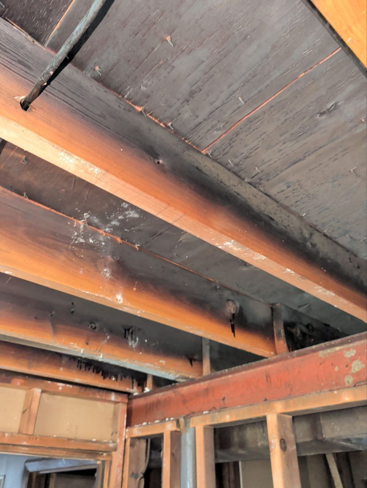 Charred ceiling framing exposed