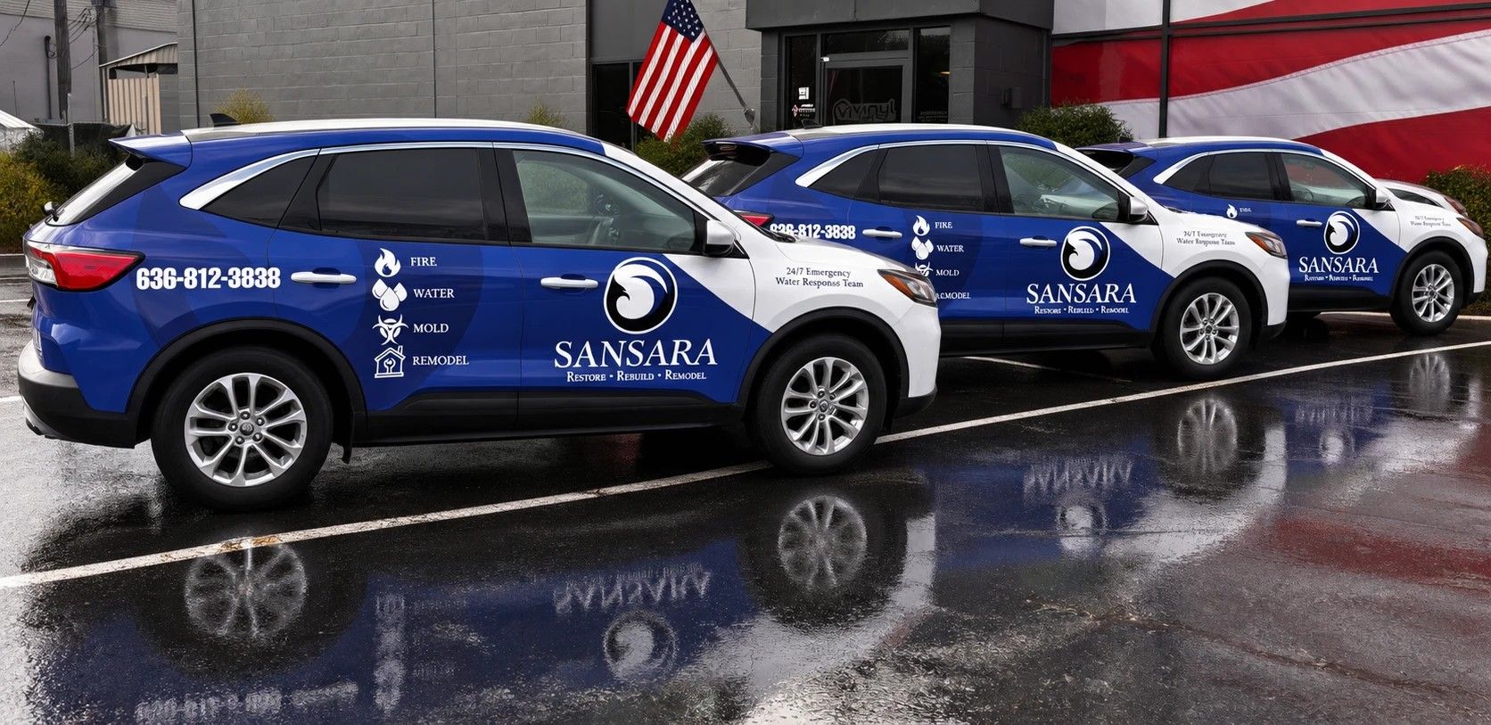 Three Sansara 24/7 Restoration & Remodeling SUVs in the company's blue and white wrap