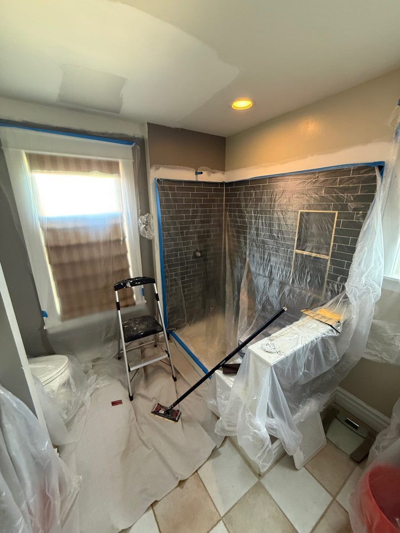Floors and fixtures protected before painting a bathroom