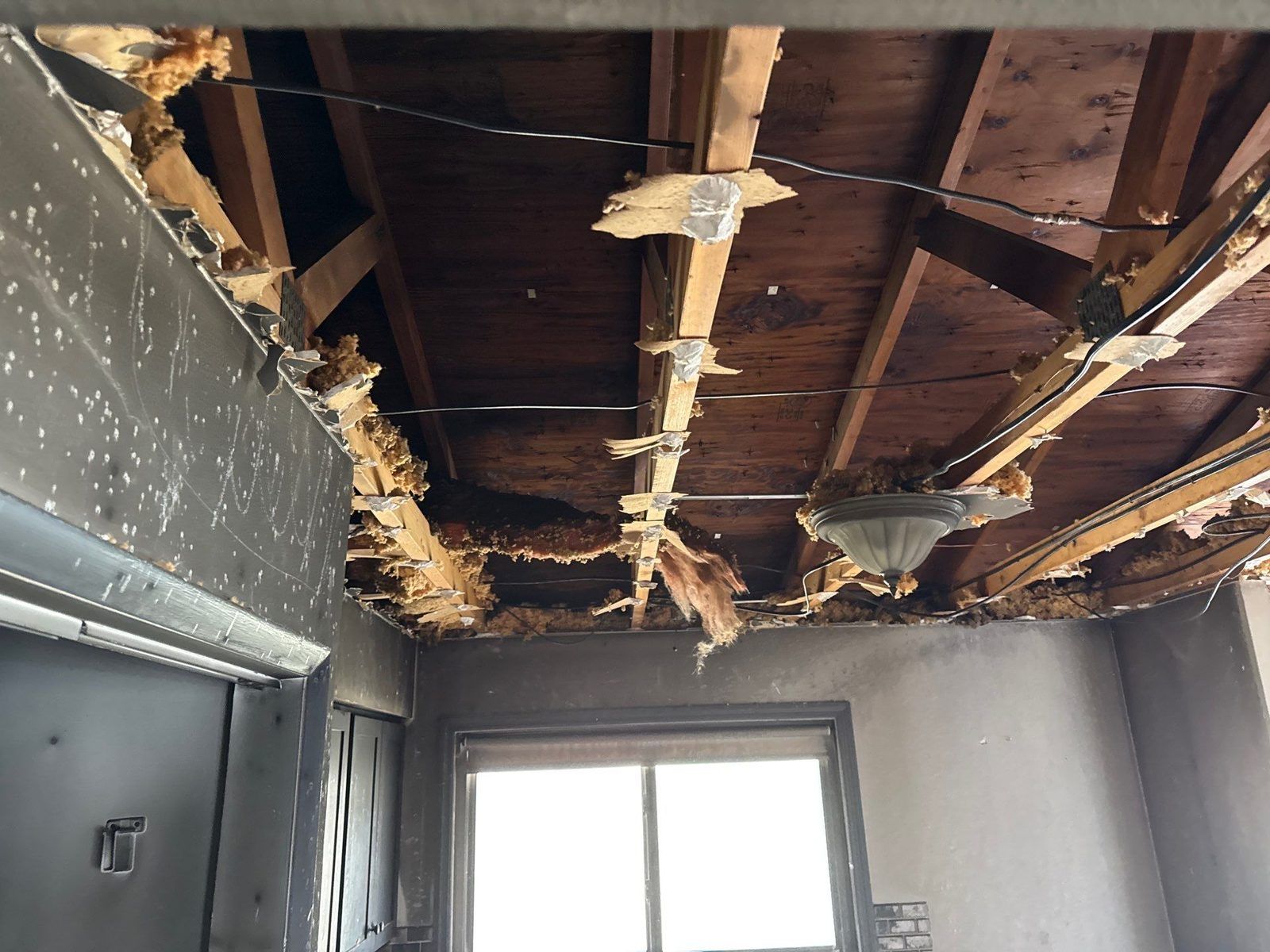 A smoke-damaged ceiling removed during fire cleanup