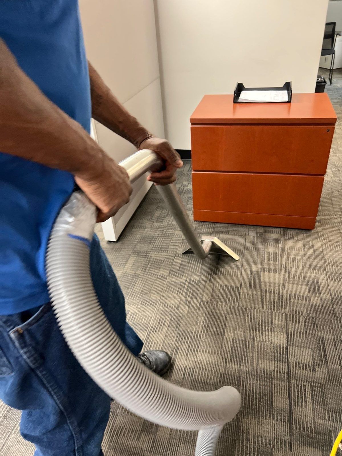 Extracting water from carpet during a water damage job